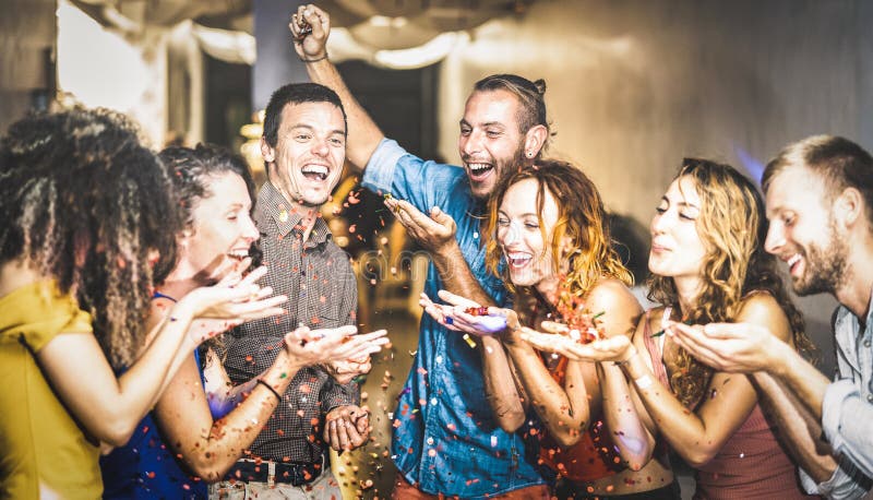 Multiracial happy friend having fun at new year`s eve celebration stock photo Multiracial happy friend having fun at new year`s eve celebration stock photo