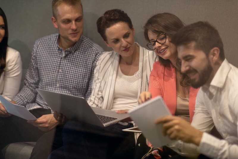 Multiracial young creative people in modern office. Group of young business people are working together with laptop stock images Multiracial young creative people in modern office. Group of young business people are working together with laptop stock images