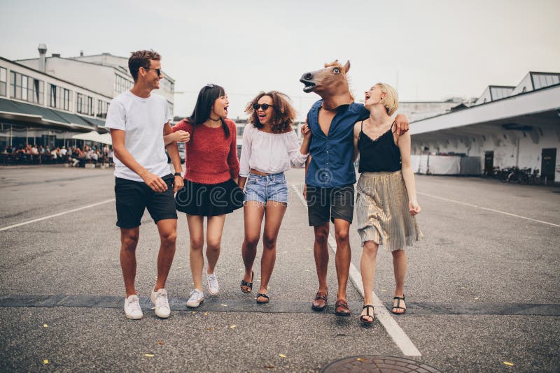 Multiracial young friends having fun together on the street