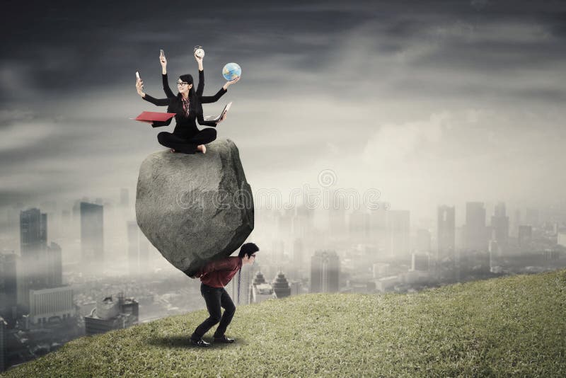 Multitasking businesswoman with her partner on hill royalty free stock image Multitasking businesswoman with her partner on hill royalty free stock image
