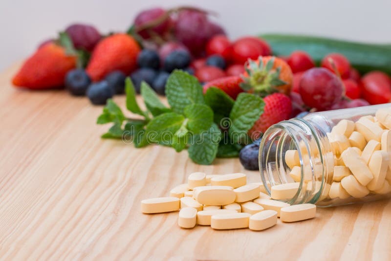 Multivitamin and Mutimineral Pills, Nutritional Supplement on White