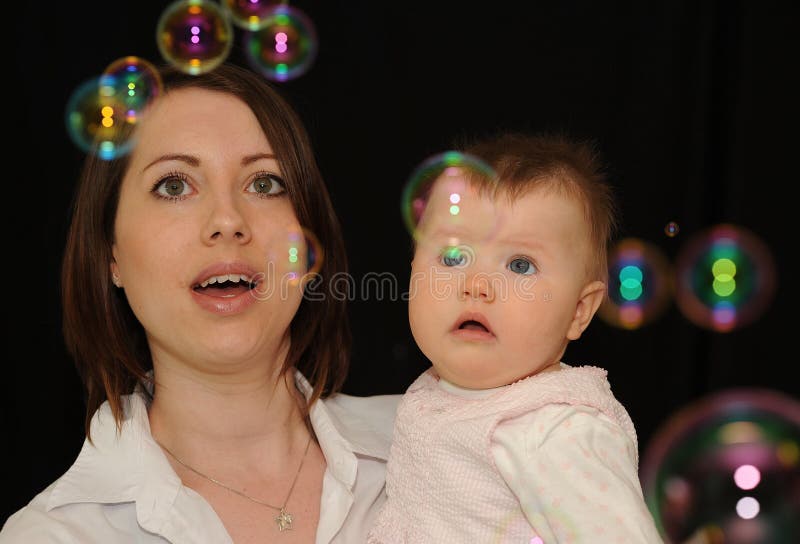 Mum and baby watching bubbles