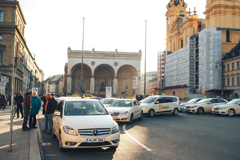 Munich, Germany, December 29, 2016: Many traditional Bavarian taxis at the Odeonsplatz square in the center of Munich royalty free stock images Munich, Germany, December 29, 2016: Many traditional Bavarian taxis at the Odeonsplatz square in the center of Munich royalty free stock images