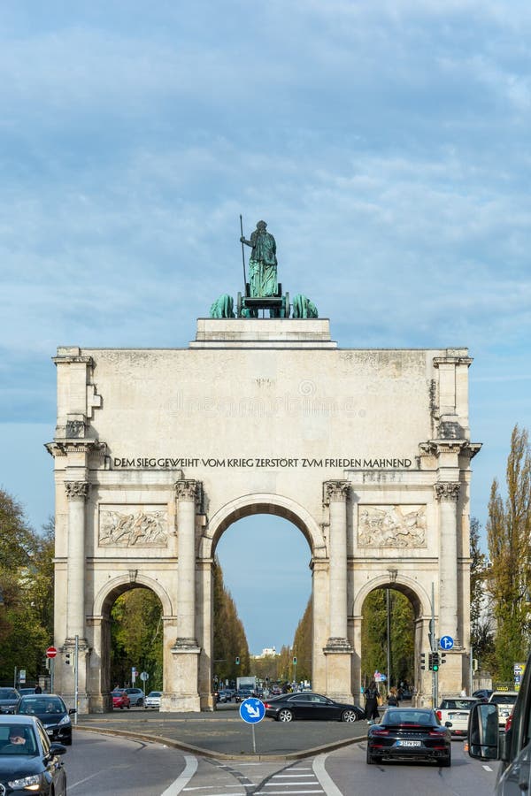 MUNICH, GERMANY - November 3, 2017: The Siegestor in Munich, Germany with traffic. MUNICH, GERMANY - November 3, 2017: The Siegestor in Munich, Germany with traffic