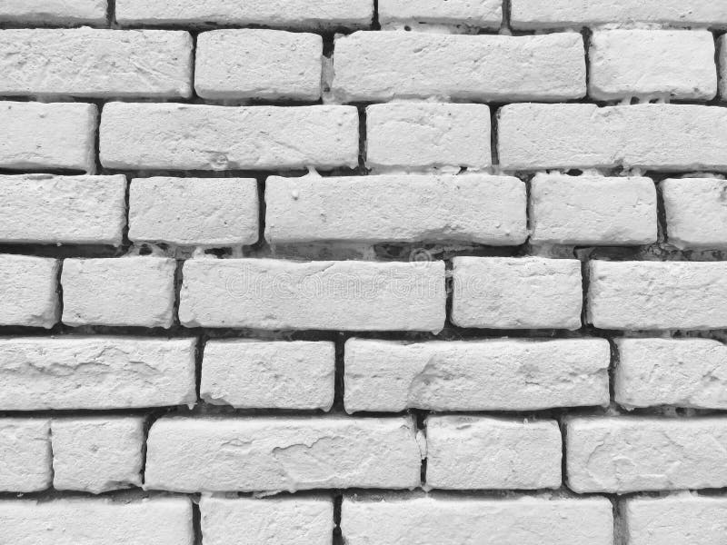 Mur de briques Vieille peinture blanche floconneuse épluchant W criqué sale image stock Mur de briques Vieille peinture blanche floconneuse épluchant W criqué sale image stock
