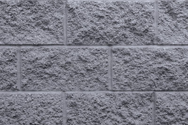 Mur de pierre grise arrière-plan nature robuste&blocs rustiques. Closeuse de pierre gris rustique à l'extérieur dans un parc