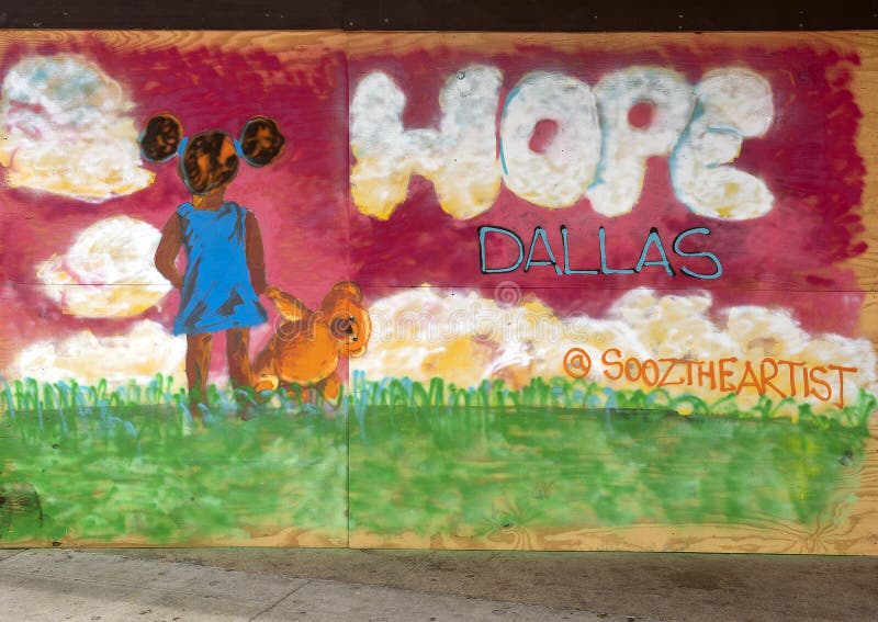 Pictured is one of many murals painted on plywood in Deep Ellum after the George Floyd protests.  The mural features the word hope and a child of color with a stuffed bear.  In May 2020 several businesses in Deep Ellum were vandalized and looted following a protest in downtown Dallas. A peaceful protest over the killing of George Floyd turned violent when a small group clashed with police, broke out windows, looted businesses and set fires.  Because of fear of looting many business put up plywood protection of their doors or windows.  Subsequently artists painted black lives themed murals on the protective plywood all over Deep Ellum.  After the 1850sâ€™ slave liberation in Texas, many slaves from Texas and nearby states built their houses and cropped their land in the future Deep Ellum, which was one of the largest African-American communities. This community holds the most history in the Dallas area.  Today it is composed largely of arts and entertainment venues and is known for it`s graffiti, street art and murals.  It is located near downtown in East Dallas, Texas. Pictured is one of many murals painted on plywood in Deep Ellum after the George Floyd protests.  The mural features the word hope and a child of color with a stuffed bear.  In May 2020 several businesses in Deep Ellum were vandalized and looted following a protest in downtown Dallas. A peaceful protest over the killing of George Floyd turned violent when a small group clashed with police, broke out windows, looted businesses and set fires.  Because of fear of looting many business put up plywood protection of their doors or windows.  Subsequently artists painted black lives themed murals on the protective plywood all over Deep Ellum.  After the 1850sâ€™ slave liberation in Texas, many slaves from Texas and nearby states built their houses and cropped their land in the future Deep Ellum, which was one of the largest African-American communities. This community holds the most history in the Dallas area.  Today it is composed largely of arts and entertainment venues and is known for it`s graffiti, street art and murals.  It is located near downtown in East Dallas, Texas.