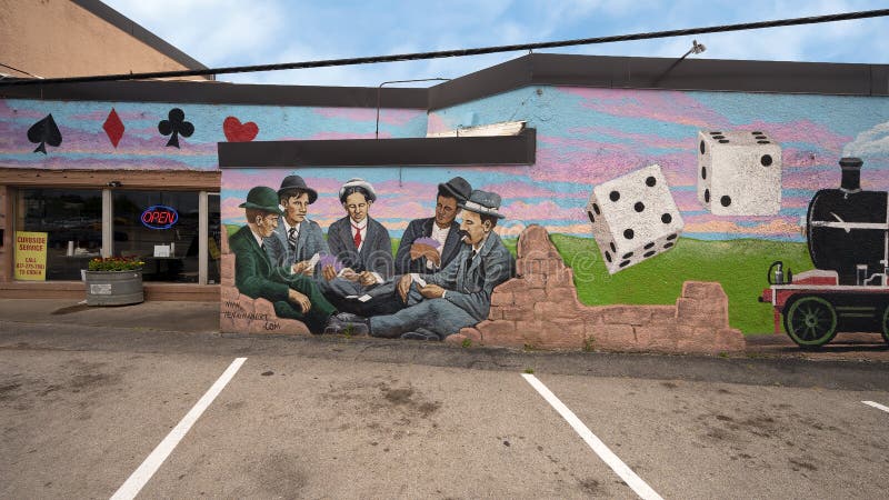 Pictured is a mural painted by Henigman Art featuring gambling dice and poker players.  It was created in 1931 on what was then the Triangle Inn, a restaurant that featured jazz bands, illegal booze and gambling.  The restaurant was midway between Arlington Downs Racetrack and the notorious Top O` Hill Casino.  Today the restaurant has become Jambo`s Barbecue Shack in the City of Arlington, Texas. Pictured is a mural painted by Henigman Art featuring gambling dice and poker players.  It was created in 1931 on what was then the Triangle Inn, a restaurant that featured jazz bands, illegal booze and gambling.  The restaurant was midway between Arlington Downs Racetrack and the notorious Top O` Hill Casino.  Today the restaurant has become Jambo`s Barbecue Shack in the City of Arlington, Texas.