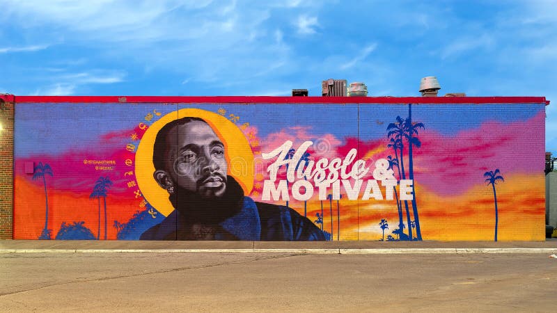Mural featuring Nipsey Hussle on the side of a restaurant in Glendale Shopping Center in Dallas, Texas.