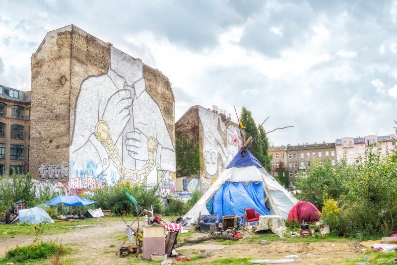 Famous murals in Kreuzberg, West Berlin, by artist Blu with homeless peoples shelter. Famous murals in Kreuzberg, West Berlin, by artist Blu with homeless peoples shelter