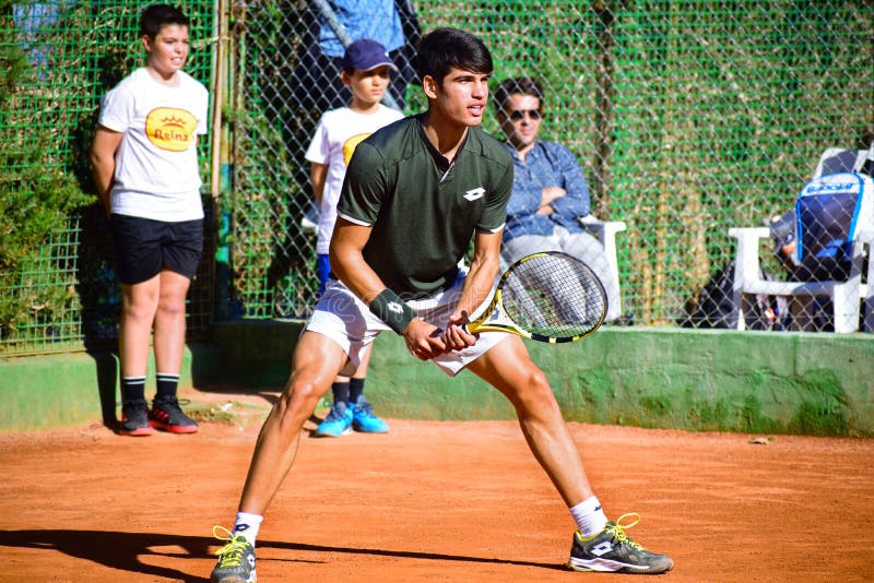 Murcia, Spain, December 26, 2019: Young sportsman training at a tennis clay court in Murcia