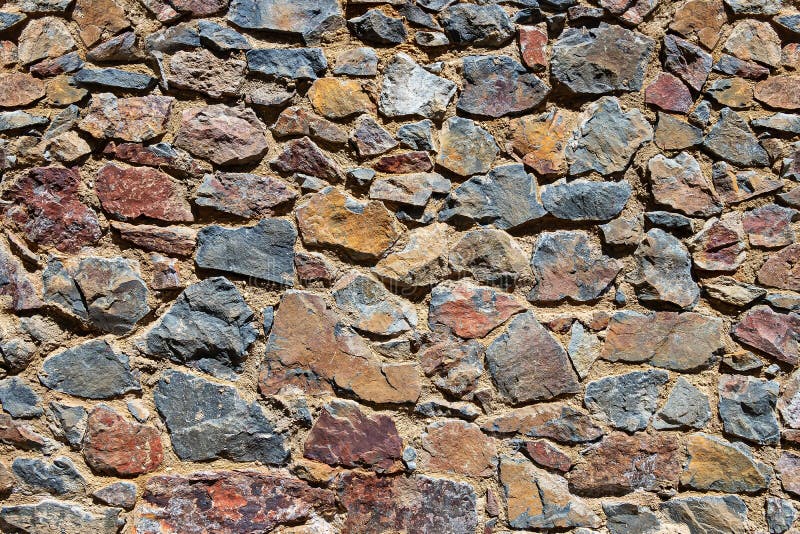 Foto De Stock Imagem Mostrando Um Muro De Pedra Rústica, Com Pontas  Irregulares, Royalty-Free