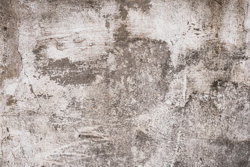 Muro di cemento misero grigio e marrone con gesso a fiocchi Vecchia struttura approssimativa lacerata della parete del cemento, f fotografia stock libera da diritti Muro di cemento misero grigio e marrone con gesso a fiocchi Vecchia struttura approssimativa lacerata della parete del cemento, f fotografia stock libera da diritti