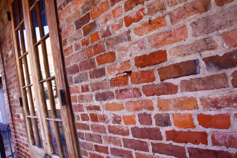 Muro di mattoni del quartiere francese di New Orleans fotografie stock Muro di mattoni del quartiere francese di New Orleans fotografie stock