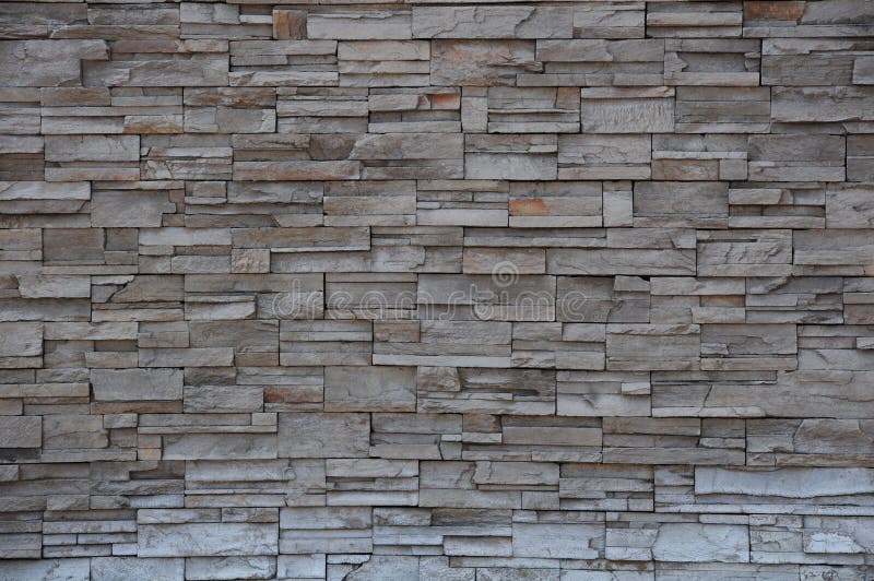 Muro di mattoni di pietra, parete di pietra del mattone moderno immagine stock libera da diritti Muro di mattoni di pietra, parete di pietra del mattone moderno immagine stock libera da diritti
