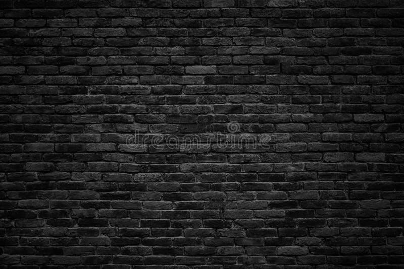 Gloomy background, black brick wall of dark stone texture. Gloomy background, black brick wall of dark stone texture