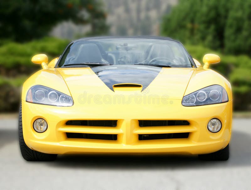 Yellow Dodge Viper sports car with a blurred background. Yellow Dodge Viper sports car with a blurred background