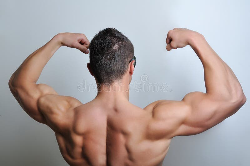 Muscle man posing in studio