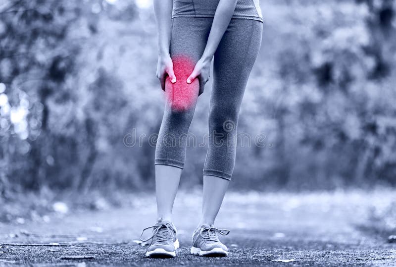 Muscle sports injury of female runner thigh. Woman running muscle strain injury in thigh. Closeup of runner touching leg in muscle pain.