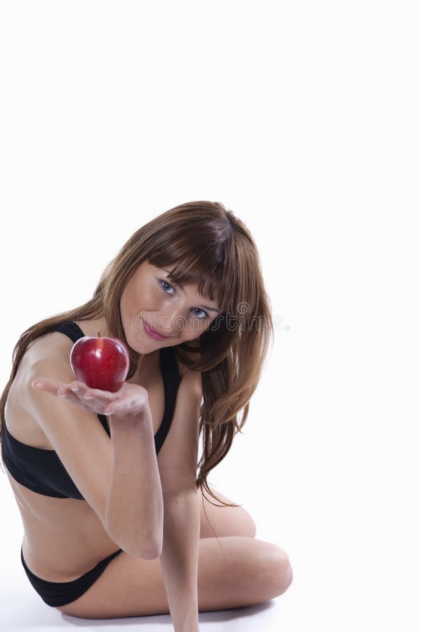 Muscle woman with apple