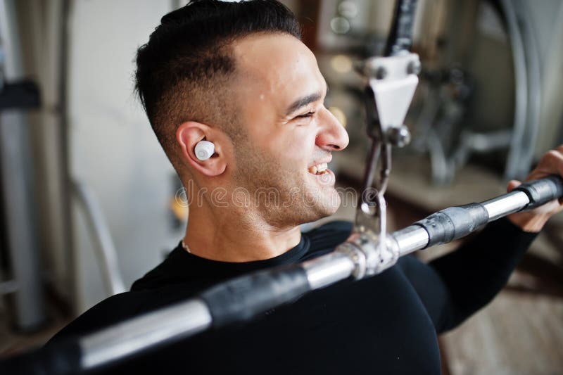 Muscular Arab Man Training and Doing Workout on Fitness Machine in Modern Gym Stock Photo - Image of bodybuilder, male: 210097442 Muscular Arab Man Training and Doing Workout on Fitness Machine in Modern Gym Stock Photo - Image of bodybuilder, male: 210097442