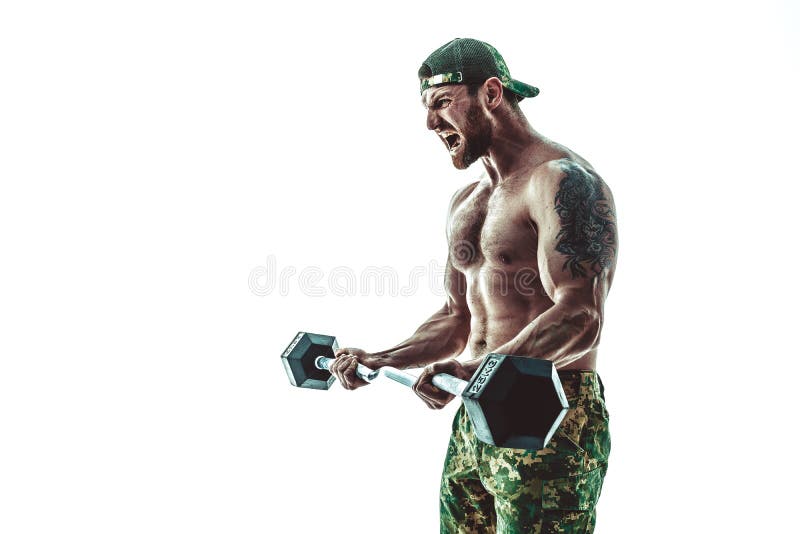 Muscular athlete bodybuilder man in camouflage pants with a naked torso workout with dumbbell on a white background. stock photo Muscular athlete bodybuilder man in camouflage pants with a naked torso workout with dumbbell on a white background. stock photo