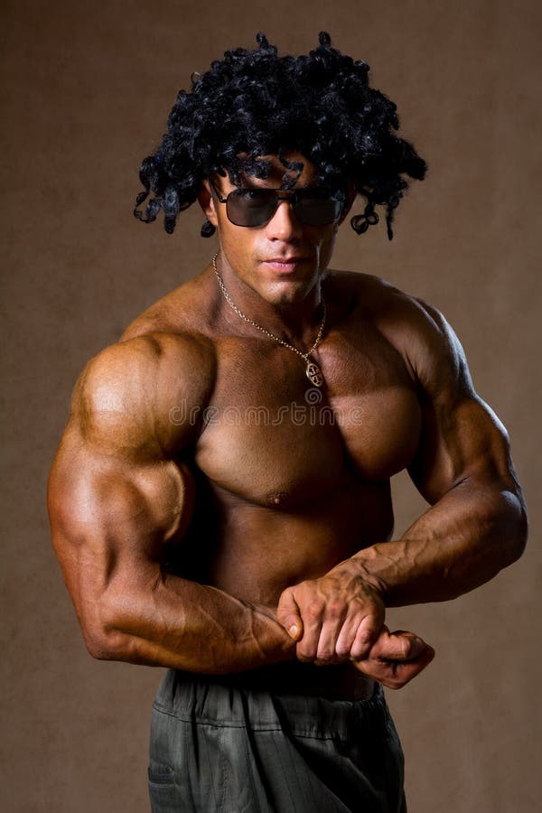Muscular Bodybuilder with Curly Hair Shows His Biceps Stock Image - Image  of black, sport: 35179971