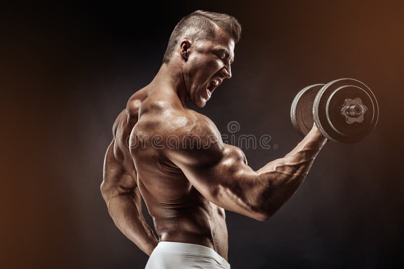 Muscular bodybuilder guy doing exercises with dumbbell