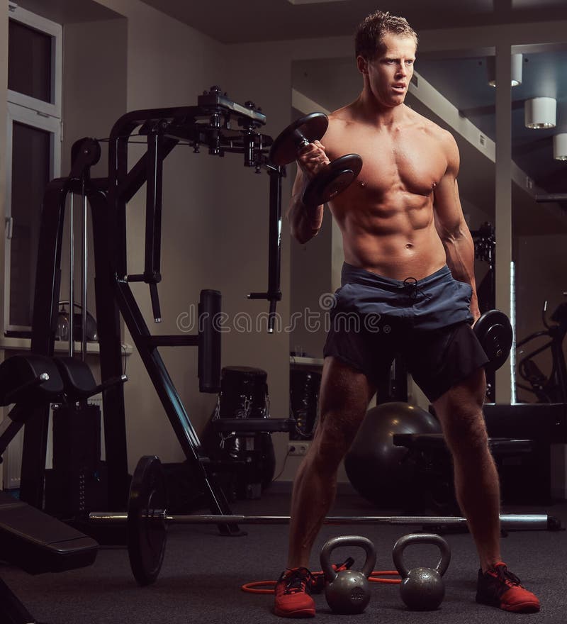 Muscular Naked Man Lifting Dumbbell Stock Images 