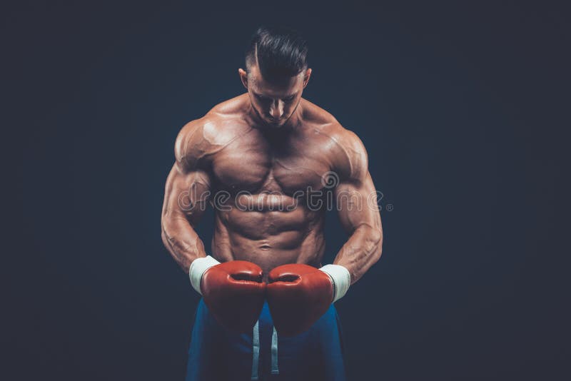 Muscular Boxer in Studio Shooting, on Black Background. Stock Photo