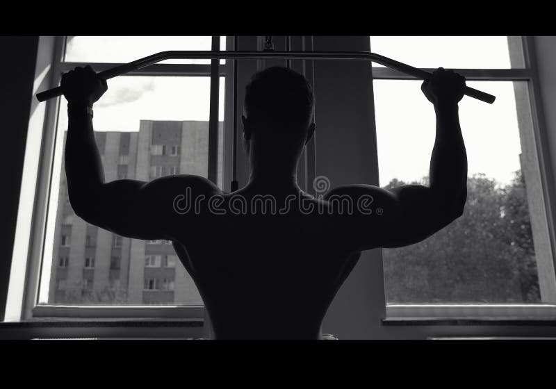 Muscular guy working out in the gym, creative photo, black white, muscle silhouette, beautiful body, physique, relief, sexy guy.