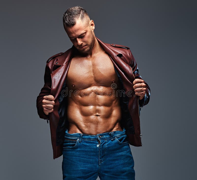 Muscular Male Dressed In A Jacket And Jeans. Stock Photo - Image of ...