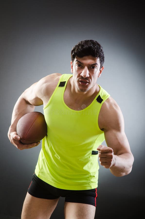 The Muscular Man with American Football Stock Photo - Image of