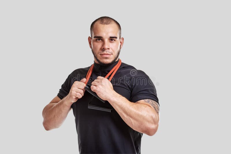 Muscular man with expander stock image