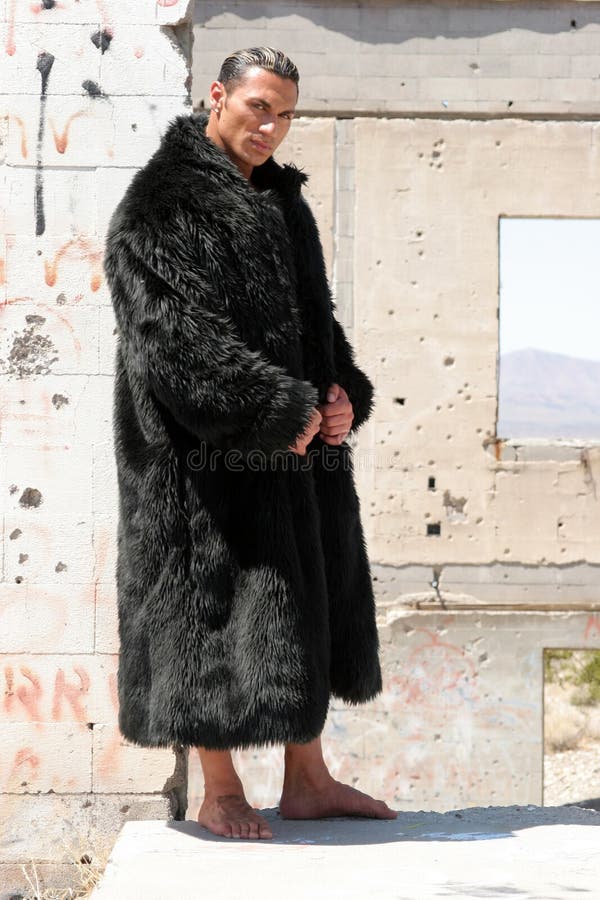 Muscular man in fur coat