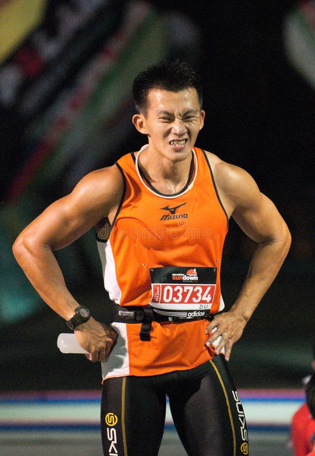 Muscular man grimace in pain after marathon run