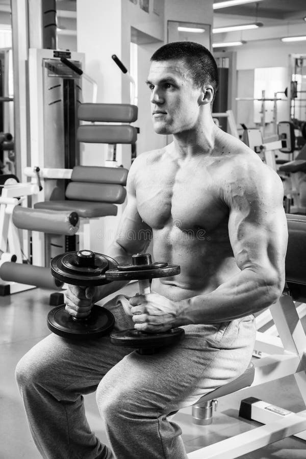 Muscular Man in the Gym Performing the Exercise Stock Image Image of