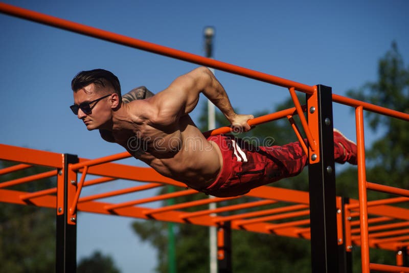 Muscular Man During His Workout On The Street Stock Image - Image of
