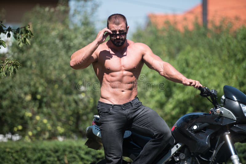 Muscular Man And Motorcycle Stock Image - Image of brand 