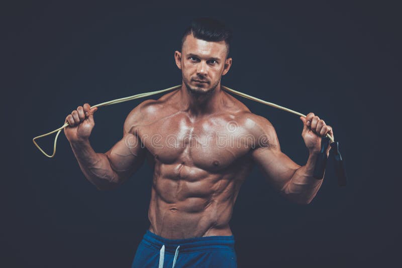 Muscular man skipping rope. active sport fitness stock image Muscular man skipping rope. active sport fitness stock image