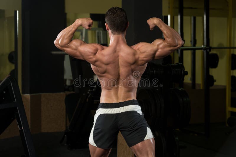 Muscular Men Is Hitting Rear Double Bicep Pose. Human, health.