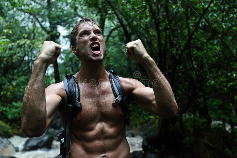 Muscular survivor man in jungle rainforest stock image Muscular survivor man in jungle rainforest stock image