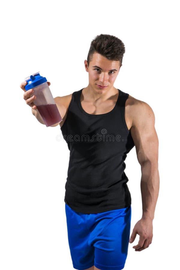 Muscular young male bodybuilder holding protein shake bottle, drinking. Isolated on white background. Muscular young male bodybuilder holding protein shake bottle, drinking. Isolated on white background