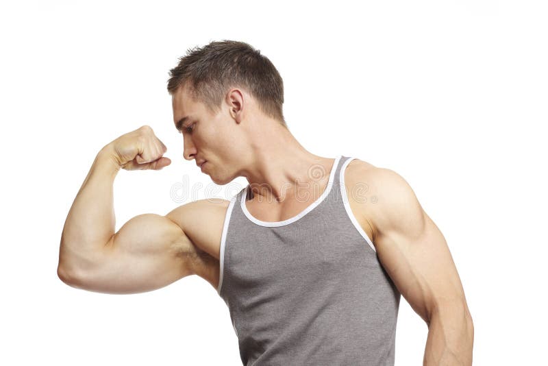 Muscular young man flexing arm muscles in sports outfit on white background
