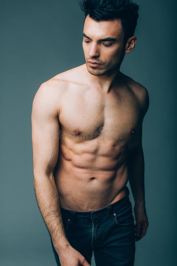 Muscular Young Guy Posing in Studio in Jeans Stock Photo - Image of macho, muscular: 68208084