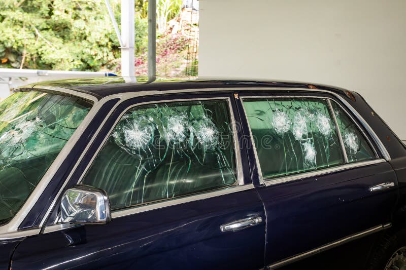 Medellin, Colombia - December 9, 2023: Car shot up of famous drug dealer Pablo Escobar in Open-air museum. Medellin, Colombia - December 9, 2023: Car shot up of famous drug dealer Pablo Escobar in Open-air museum.