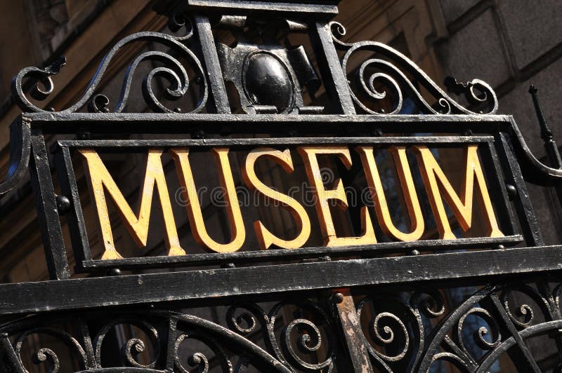 Museum sign on old metallic gate