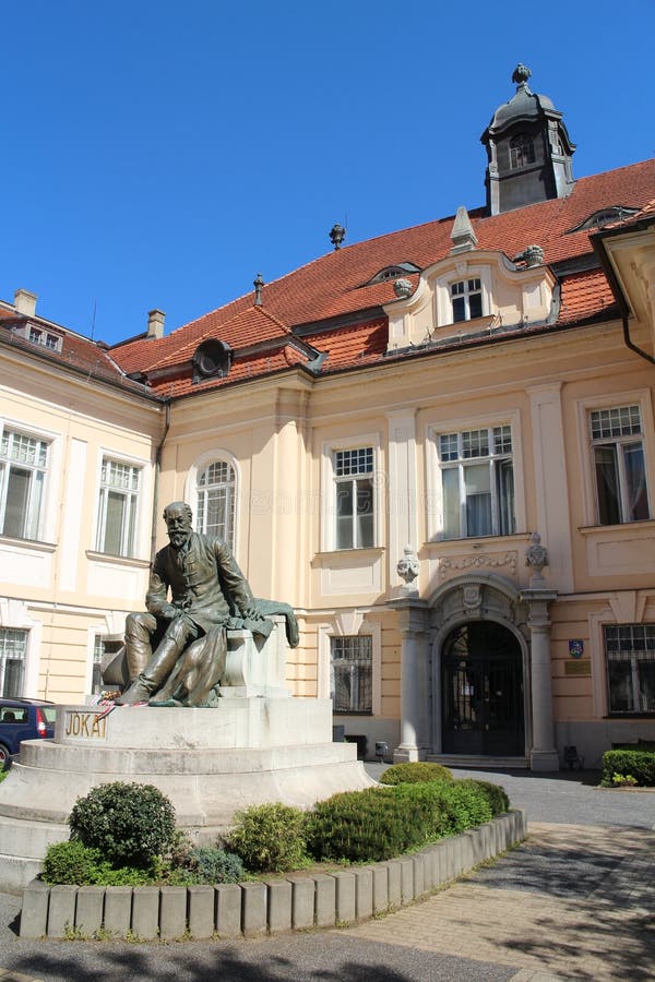 Museum of Danube with statue of writer Mor Jokai on Palatinova street in Komarno