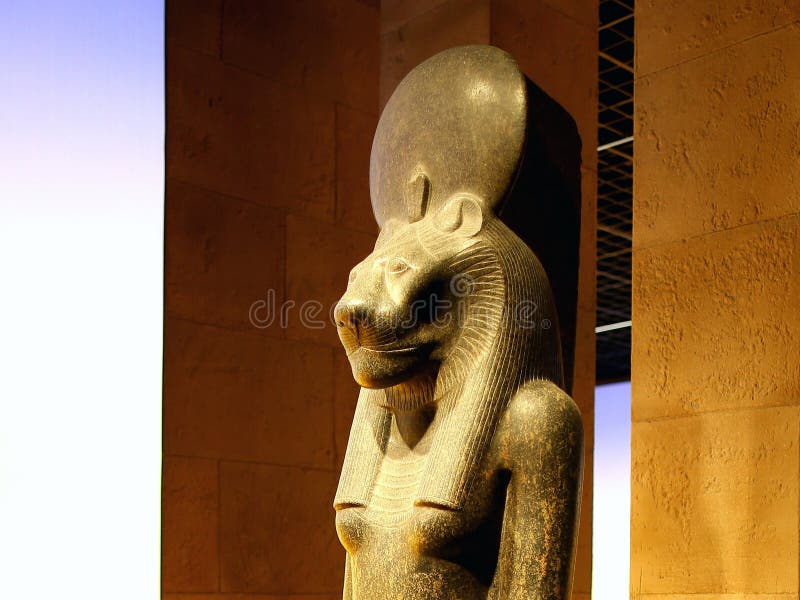 In the glorious treasure - house of ancient Egyptian religious art, the "Seated statue of Sekhmet with cartouches of Amenhotep III" is a gem of great historical and religious value. Carved from red granite, this seated statue dates back to the 18th Dynasty (1550 - 1295 BCE), was unearthed from the Mut Temple at Karnak, and is now treasured in the Egyptian Museum in Cairo. Sekhmet was a powerful and majestic goddess in ancient Egyptian mythology, often regarded as the goddess of war and healing. Pharaoh Amenhotep III of the 18th Dynasty built numerous statues of her, aiming to appease the goddess and harness her power to protect the country. This seated statue was unearthed from the Mut Temple at Karnak. The goddess holds the Ankh symbol, which represents life, in her left hand. The solar disk and the uraeus on her head highlight her divinity and majesty. The papyrus, water lily, and the heart - lung symbol carved on the side of the seat signify the unity of Upper and Lower Egypt. The inscriptions on the seated statue are also profound. The left - side inscription praises the goodness and blessings of the deity, while the right - side inscription showcases the pharaoh's identity and being loved by the deity. Artistically, the red granite material endows the seated statue with a sense of solemnity, and the exquisite carving techniques fully demonstrate the superb skills of ancient Egyptian craftsmen. It is not only a concrete manifestation of religious beliefs but also important physical evidence for studying ancient Egyptian religious culture, artistic styles, and political symbols. It leads us through time and space to appreciate the unique charm of the intertwining of ancient Egyptian religion and royal power.