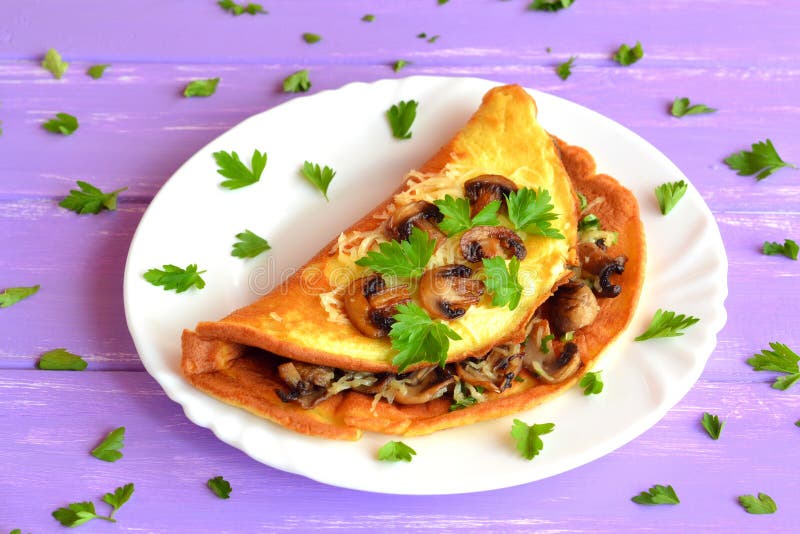 Mushroom And Cheese Omelet With Herbs On A Plate. Breakfast Egg Recipe